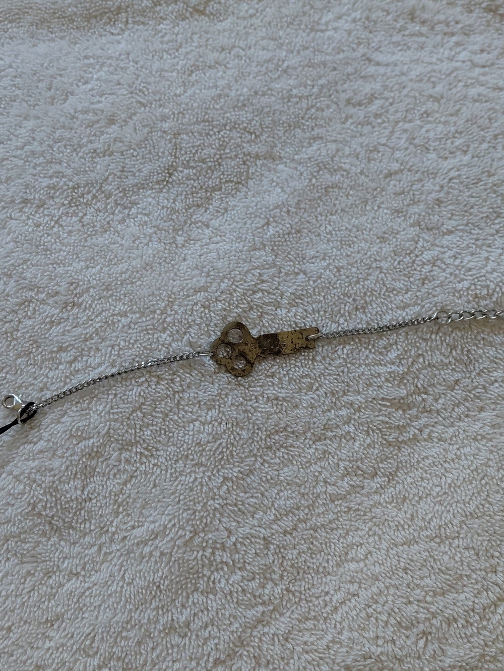 Delicate Silver Chain Bracelet with Distressed Silver Key Charm That Says 'Love'